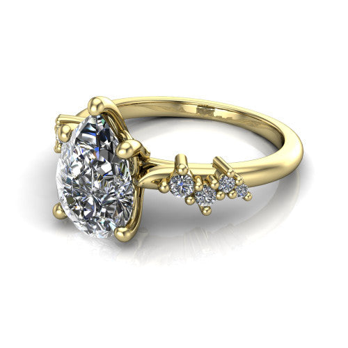 Georgia pear classic engagement ring in 18K Yellow Gold, three-quarter perspective showing the pear center diamond and scattered cluster accents on the band