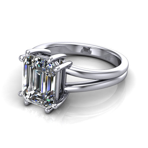 Lainey emerald-cut solitaire engagement ring in 14K White Gold, three-quarter perspective showing the emerald-cut center diamond raised in a double-claw prong head on a polished band