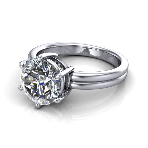 Lainey round solitaire engagement ring in Platinum, three-quarter perspective showing the round center diamond raised in a double-claw prong head on a polished band