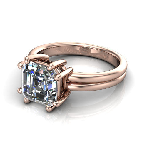Lainey square emerald-cut solitaire engagement ring in 14K Rose Gold, three-quarter perspective showing the square emerald-cut center diamond raised in a double-claw prong head on a polished band