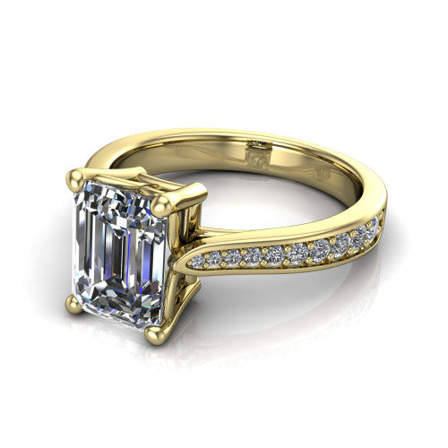 Myla emerald-cut classic engagement ring in 14K Yellow Gold, three-quarter perspective showing the emerald-cut center diamond in a four-prong cathedral head above a pave band