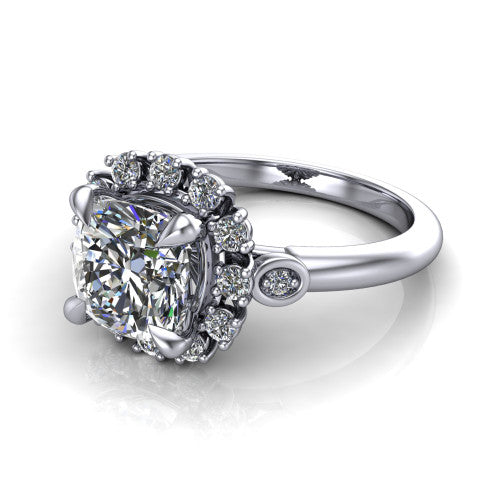 June cushion halo engagement ring in 18K White Gold, three-quarter perspective showing the cushion center diamond in an ornate cluster halo with bezel side accents