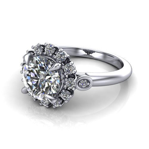June round halo engagement ring in 18K White Gold, three-quarter perspective showing the round center diamond in an ornate cluster halo with bezel side accents