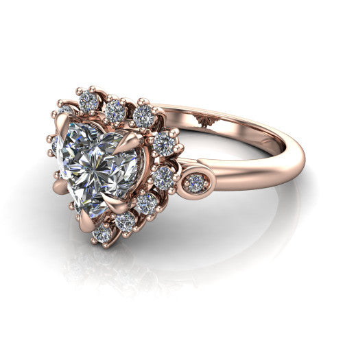 June heart halo engagement ring in 14K Rose Gold, three-quarter perspective showing the heart center diamond in an ornate cluster halo with bezel side accents