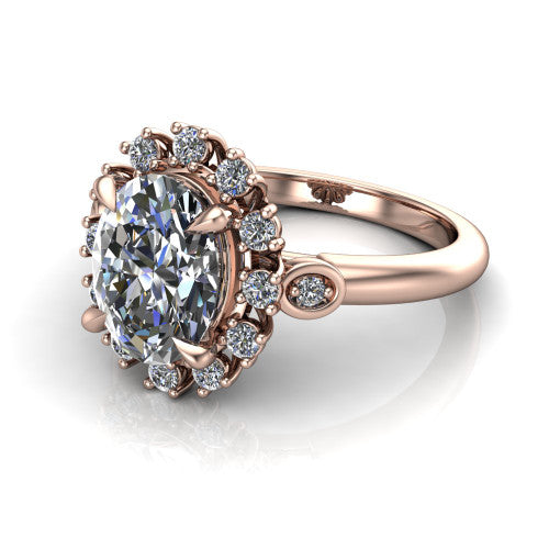June oval halo engagement ring in 14K Rose Gold, three-quarter perspective showing the oval center diamond in an ornate cluster halo with bezel side accents