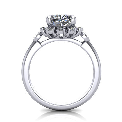 June cushion halo engagement ring in Platinum, through-finger front profile showing the cluster halo and bezel accents from the front