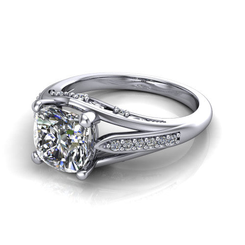 Blakely cushion solitaire engagement ring in 18K White Gold, three-quarter perspective showing the cushion center diamond above a split-shank pave band with filigree gallery