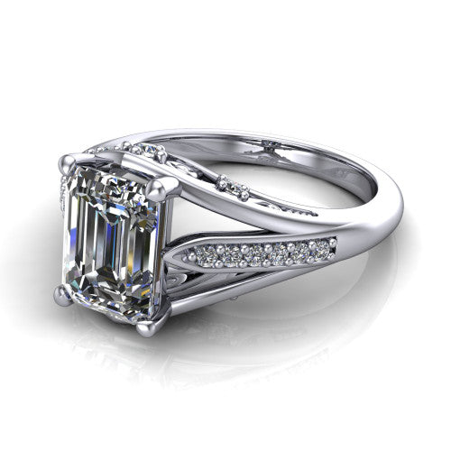 Blakely emerald-cut solitaire engagement ring in 14K White Gold, three-quarter perspective showing the emerald-cut center diamond above a split-shank pave band with filigree gallery