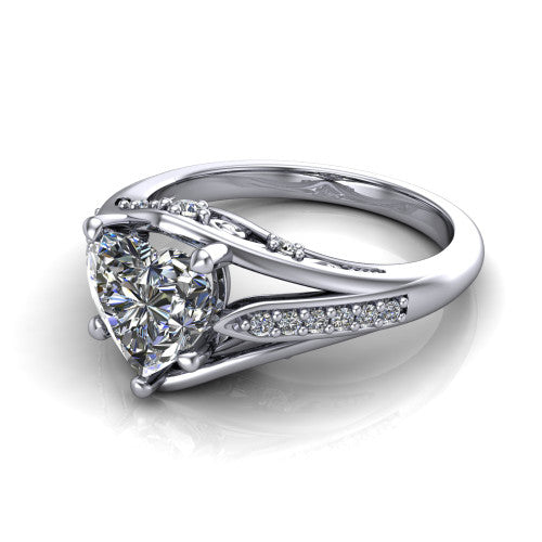 Blakely heart solitaire engagement ring in Platinum, three-quarter perspective showing the heart center diamond above a split-shank pave band with filigree gallery