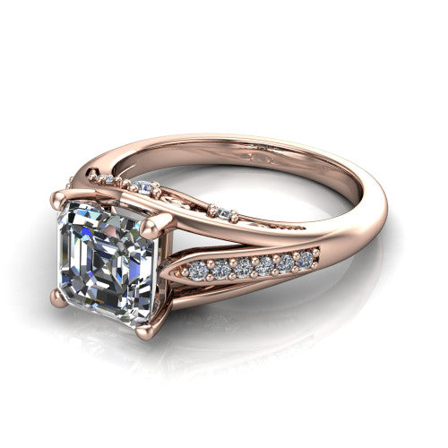Blakely square emerald-cut solitaire engagement ring in 18K Rose Gold, three-quarter perspective showing the square emerald-cut center diamond above a split-shank pave band with filigree gallery