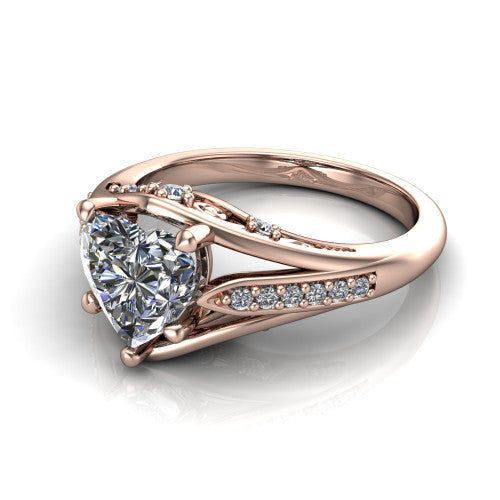 Blakely heart solitaire engagement ring in 14K Rose Gold, three-quarter perspective showing the heart center diamond above a split-shank pave band with filigree gallery