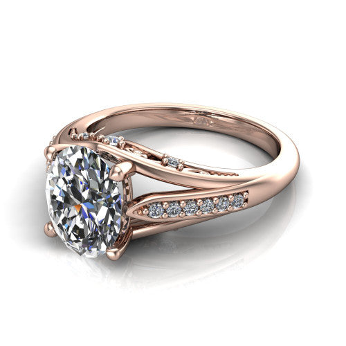 Blakely oval solitaire engagement ring in 14K Rose Gold, three-quarter perspective showing the oval center diamond above a split-shank pave band with filigree gallery