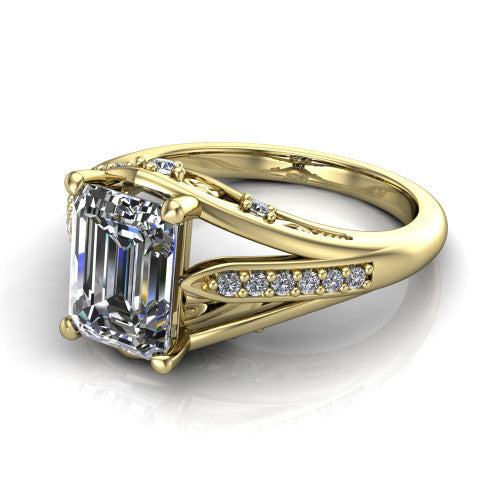 Blakely emerald-cut solitaire engagement ring in 14K Yellow Gold, three-quarter perspective showing the emerald-cut center diamond above a split-shank pave band with filigree gallery