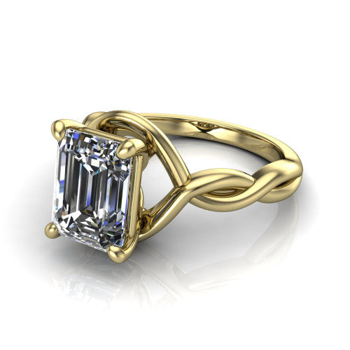 Norah emerald-cut classic engagement ring in 14K Yellow Gold, three-quarter perspective showing the emerald-cut center diamond above a twisted infinity love-knot band