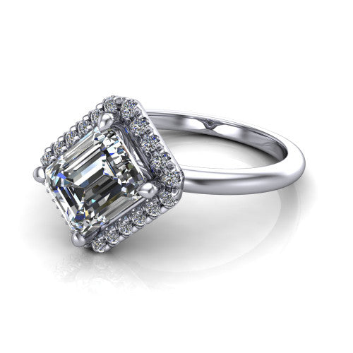 Callie emerald-cut halo engagement ring in 14K White Gold, three-quarter perspective showing the emerald-cut center diamond set diagonally in a pave halo on a thin band