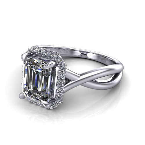 Molly emerald-cut halo engagement ring in Platinum, three-quarter perspective showing the emerald-cut center diamond in a pave halo above a twisted infinity band