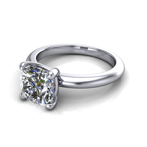 Noelle cushion classic solitaire engagement ring in Platinum, three-quarter perspective showing the prong-set center raised above a slim plain polished band