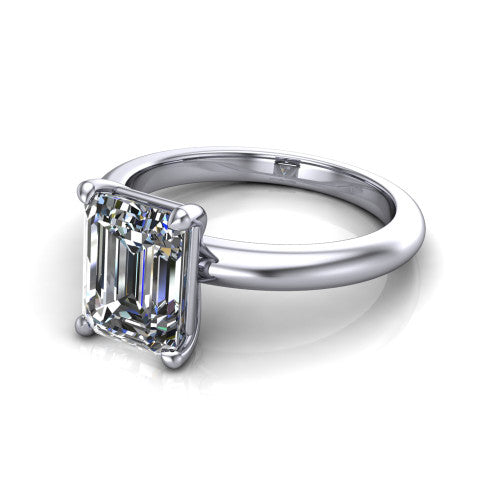 Noelle emerald classic solitaire engagement ring in 14K White Gold, three-quarter perspective showing the prong-set center raised above a slim plain polished band