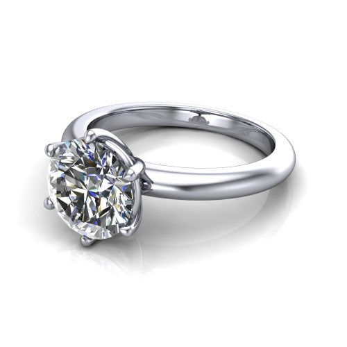 Noelle round classic solitaire engagement ring in 18K White Gold, three-quarter perspective showing the prong-set center raised above a slim plain polished band