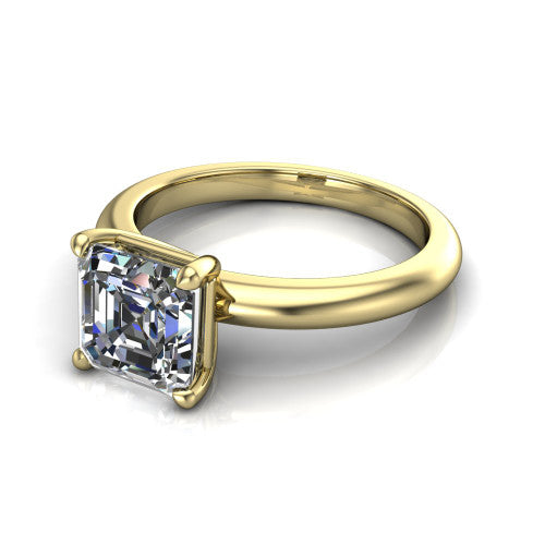 Noelle square emerald classic solitaire engagement ring in 18K Yellow Gold, three-quarter perspective showing the prong-set center raised above a slim plain polished band