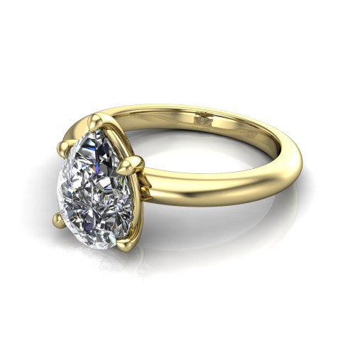 Noelle pear classic solitaire engagement ring in 14K Yellow Gold, three-quarter perspective showing the prong-set center raised above a slim plain polished band