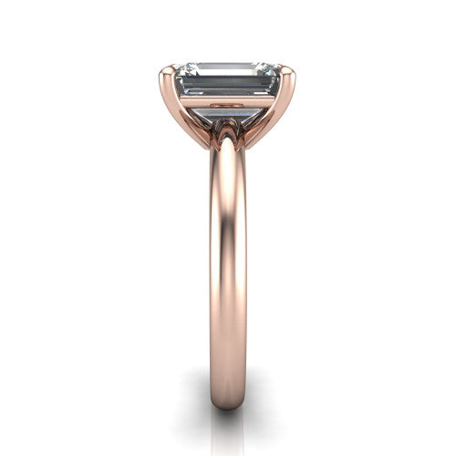 Noelle emerald classic solitaire engagement ring in 14K Rose Gold, side profile showing the plain polished band and the prong setting in profile