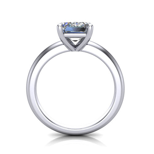 Noelle emerald classic solitaire engagement ring in Platinum, through-finger front profile showing the prong head raised above the plain shank