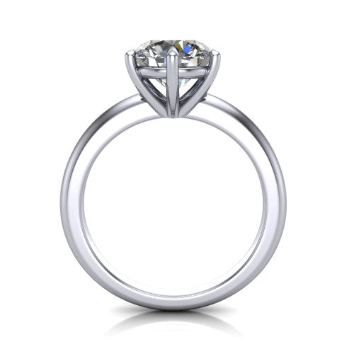 Noelle round classic solitaire engagement ring in 14K White Gold, through-finger front profile showing the prong head raised above the plain shank
