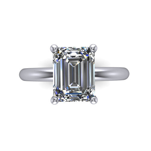 Noelle emerald classic solitaire engagement ring in Platinum, top-down view showing the center stone and the smooth band from above