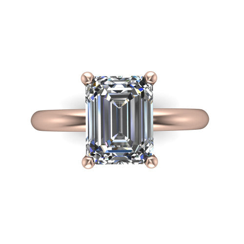 Noelle emerald classic solitaire engagement ring in 18K Rose Gold, top-down view showing the center stone and the smooth band from above
