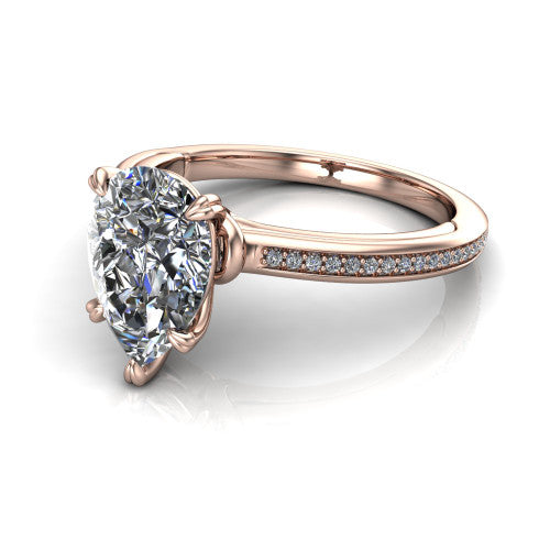 Kimberly pear classic engagement ring in 18K Rose Gold, three-quarter perspective showing the pear center diamond in a four-prong head above a thin pave band