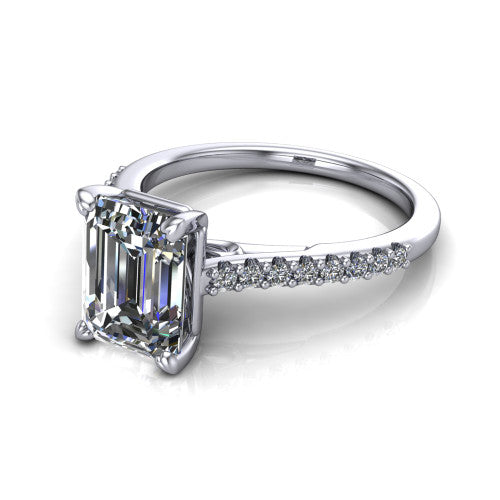 Milani emerald-cut classic engagement ring in 18K White Gold, three-quarter perspective showing the emerald-cut center diamond, double-claw prongs, and pavé shoulders