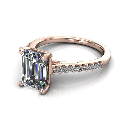 Milani emerald-cut classic engagement ring in 14K Rose Gold, three-quarter perspective showing the emerald-cut center diamond, double-claw prongs, and pavé shoulders