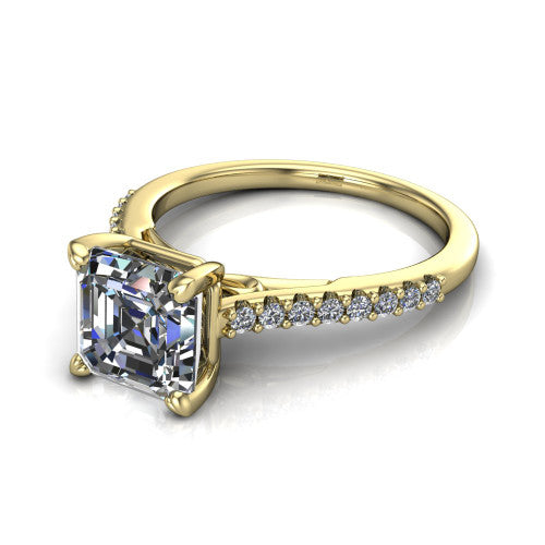 Milani square emerald-cut classic engagement ring in 18K Yellow Gold, three-quarter perspective showing the square emerald-cut center diamond, double-claw prongs, and pavé shoulders