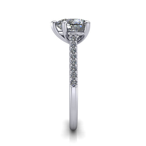 Milani heart-shaped classic engagement ring in Platinum, side profile showing the pavé shoulders and bow-motif gallery