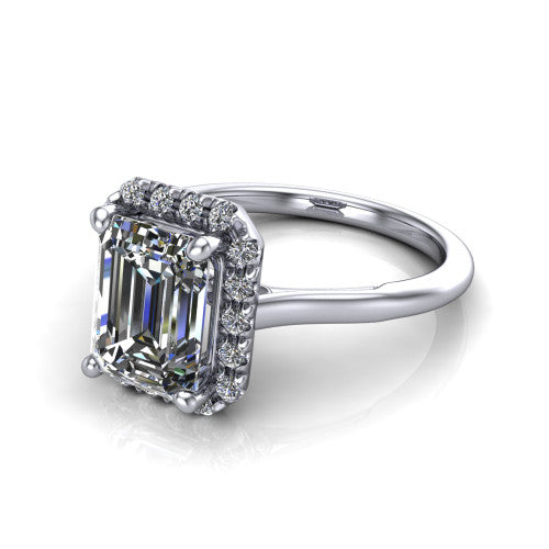 Gemma emerald-cut halo engagement ring in 14K White Gold, three-quarter perspective showing the emerald-cut center diamond in a pave halo above a thin band