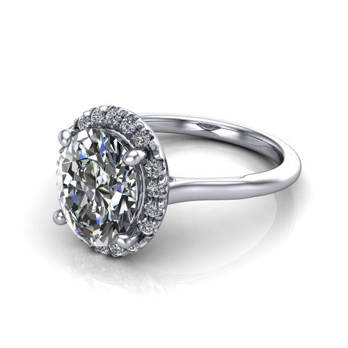 Gemma oval halo engagement ring in Platinum, three-quarter perspective showing the oval center diamond in a pave halo above a thin band