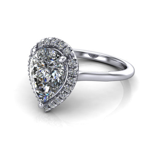 Gemma pear halo engagement ring in Platinum, three-quarter perspective showing the pear center diamond in a pave halo above a thin band