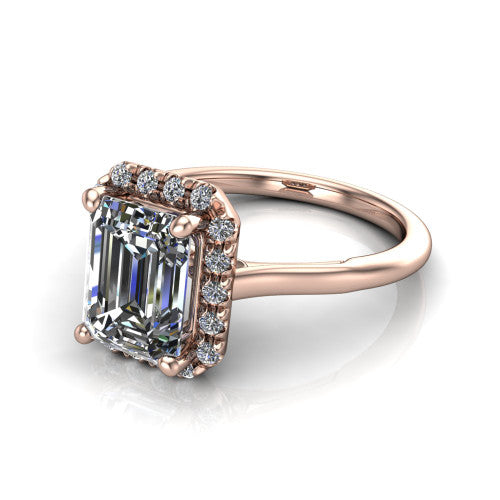 Gemma emerald-cut halo engagement ring in 14K Rose Gold, three-quarter perspective showing the emerald-cut center diamond in a pave halo above a thin band