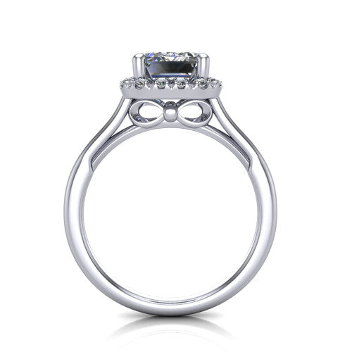Gemma emerald-cut halo engagement ring in Platinum, through-finger front profile showing the decorative bow gallery and halo from the front