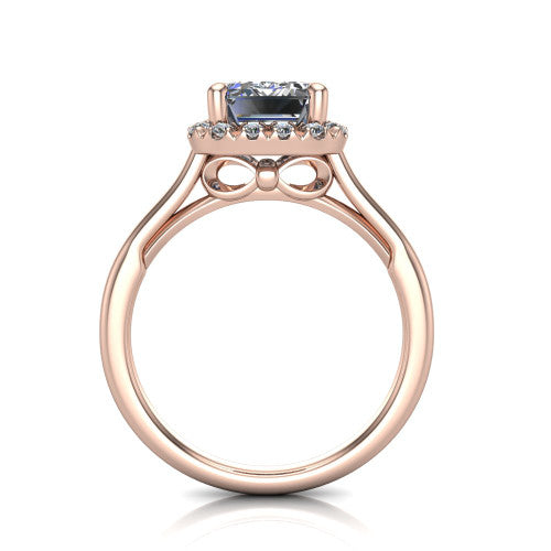 Gemma emerald-cut halo engagement ring in 14K Rose Gold, through-finger front profile showing the decorative bow gallery and halo from the front