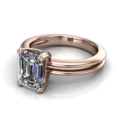 Peyton emerald-cut classic engagement ring in 14K Rose Gold, three-quarter perspective showing the emerald-cut center diamond, double-claw prongs, and split shank
