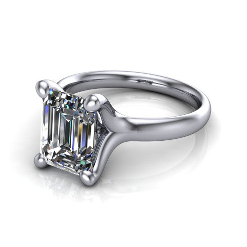 Brynlee emerald-cut classic engagement ring in 14K White Gold, three-quarter perspective showing the emerald-cut center diamond above a clean polished band