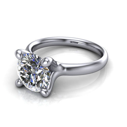 Brynlee round classic engagement ring in Platinum, three-quarter perspective showing the round center diamond above a clean polished band