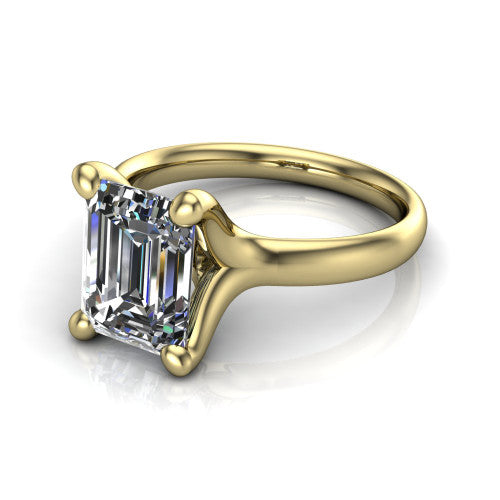 Brynlee emerald-cut classic engagement ring in 18K Yellow Gold, three-quarter perspective showing the emerald-cut center diamond above a clean polished band