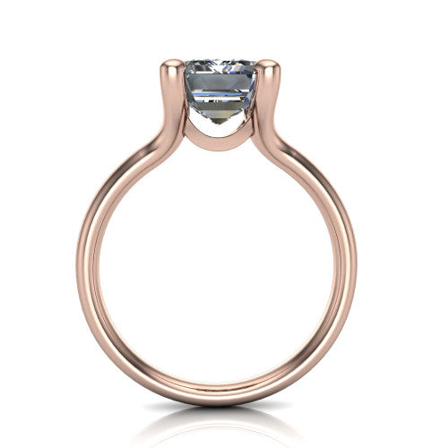Brynlee emerald-cut classic engagement ring in 18K Rose Gold, through-finger front profile showing the four-prong head and open gallery from the front