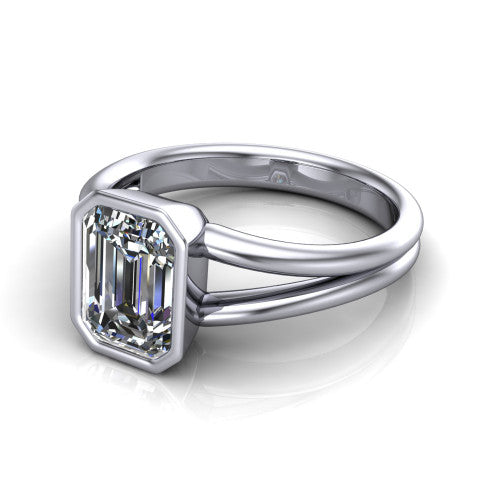 Emersyn emerald-cut classic engagement ring in Platinum, three-quarter perspective showing the bezel-set emerald-cut center diamond and split shank