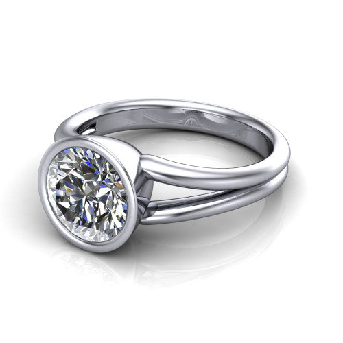 Emersyn round classic engagement ring in Platinum, three-quarter perspective showing the bezel-set round center diamond and split shank