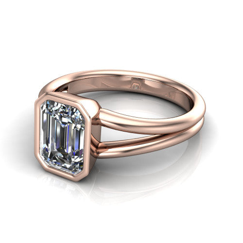 Emersyn emerald-cut classic engagement ring in 14K Rose Gold, three-quarter perspective showing the bezel-set emerald-cut center diamond and split shank
