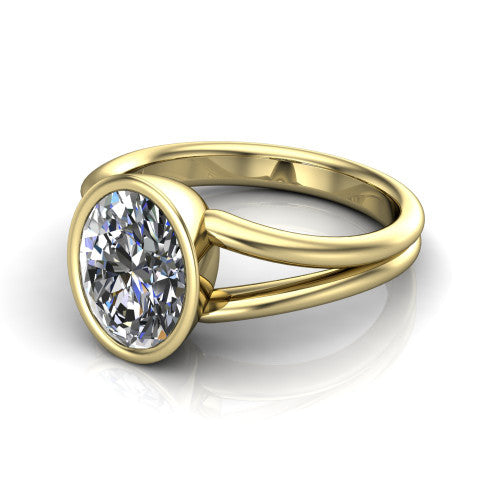 Emersyn oval classic engagement ring in 18K Yellow Gold, three-quarter perspective showing the bezel-set oval center diamond and split shank